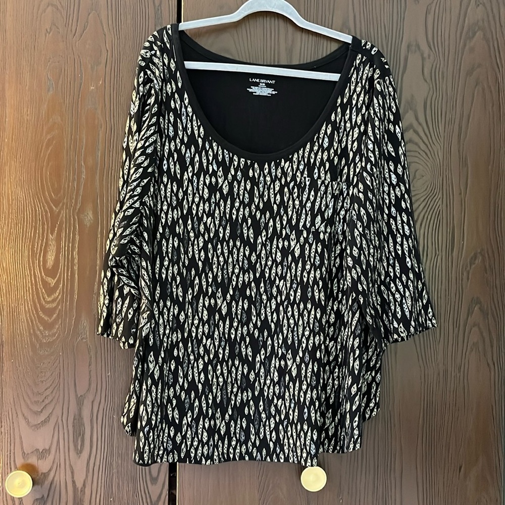 Lane Bryant scoop neck. 3/4 sleeved black top with leaves. Size 26/28.